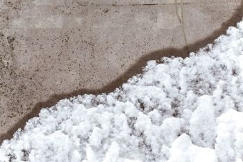 Icy Road In Winter Over Air Entrained Concrete Slab 